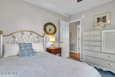 6707 Kings Lynn Dr, Oak Island, NC 28465 - bedroom with ceiling fan