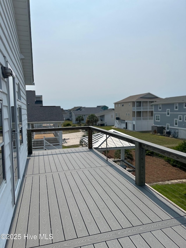 6707 Kings Lynn Dr, Oak Island, NC 28465 - wooden terrace featuring a residential view