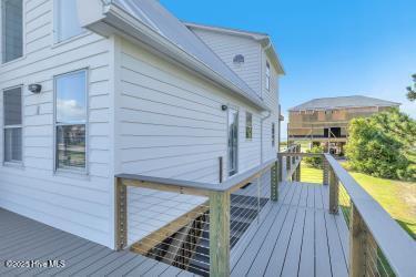 6707 Kings Lynn Dr, Oak Island, NC 28465 - view of wooden deck