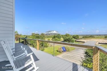 6707 Kings Lynn Dr, Oak Island, NC 28465 - view of wooden terrace