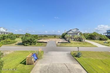 6707 Kings Lynn Dr, Oak Island, NC 28465 - view of concrete driveway