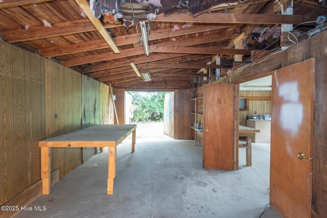 1772 NC-5 Hwy, Aberdeen, NC 28315 - garage featuring wooden walls and washer / dryer