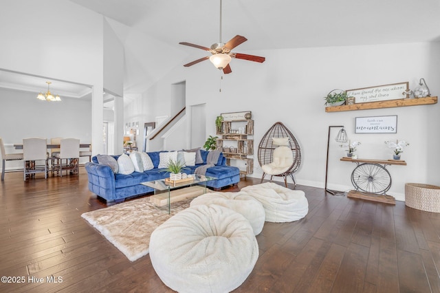 100 Little Acorn Trl, Moyock, NC 27958 - living area with ceiling fan, a chandelier, hardwood / wood-style floors, stairway, and high vaulted ceiling