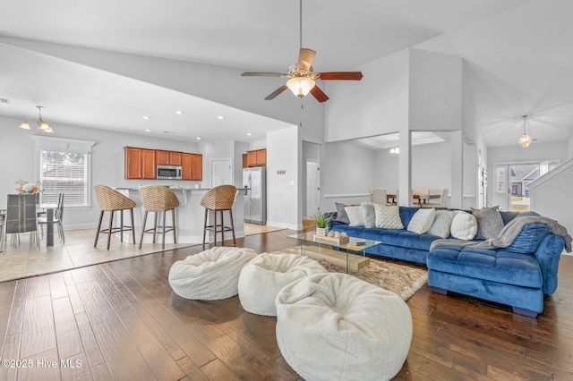 100 Little Acorn Trl, Moyock, NC 27958 - living room featuring ceiling fan, hardwood / wood-style flooring, recessed lighting, high vaulted ceiling, and baseboards