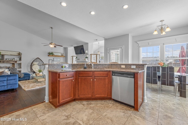 100 Little Acorn Trl, Moyock, NC 27958 - kitchen with dishwasher, open floor plan, a chandelier, ceiling fan, and stone countertops