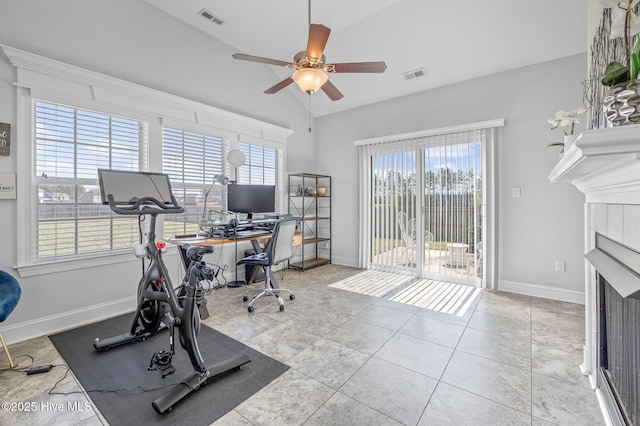 100 Little Acorn Trl, Moyock, NC 27958 - workout area featuring plenty of natural light, a ceiling fan, a fireplace, baseboards, and lofted ceiling