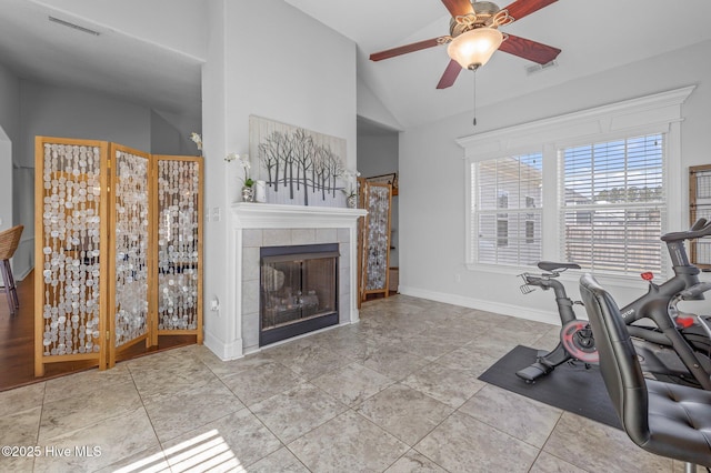 100 Little Acorn Trl, Moyock, NC 27958 - exercise area with vaulted ceiling, a ceiling fan, a tile fireplace, and baseboards