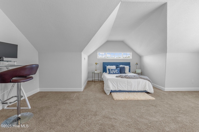 100 Little Acorn Trl, Moyock, NC 27958 - bedroom with vaulted ceiling, carpet, baseboards, and a textured ceiling