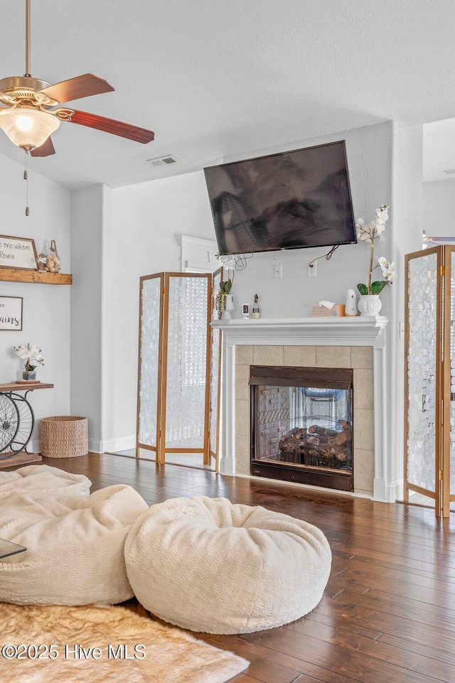 100 Little Acorn Trl, Moyock, NC 27958 - living room with a fireplace, hardwood / wood-style floors, and a ceiling fan