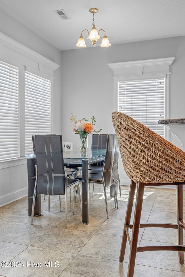 100 Little Acorn Trl, Moyock, NC 27958 - dining space featuring a chandelier and baseboards