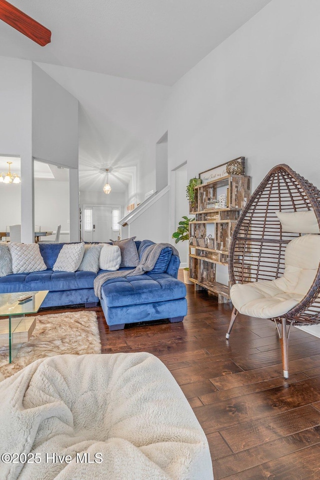 100 Little Acorn Trl, Moyock, NC 27958 - living room featuring wood-type flooring, vaulted ceiling, and a chandelier