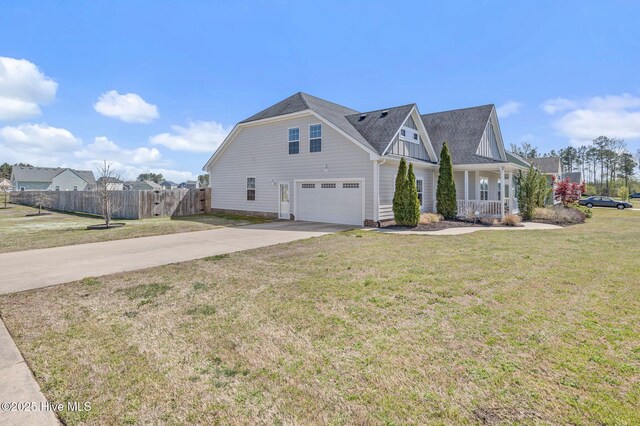100 Little Acorn Trl, Moyock, NC 27958 - view of side of home with an attached garage, concrete driveway, a porch, and a shingled roof