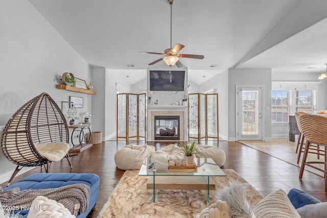 100 Little Acorn Trl, Moyock, NC 27958 - living room with hardwood / wood-style floors, ceiling fan, lofted ceiling, baseboards, and a tiled fireplace