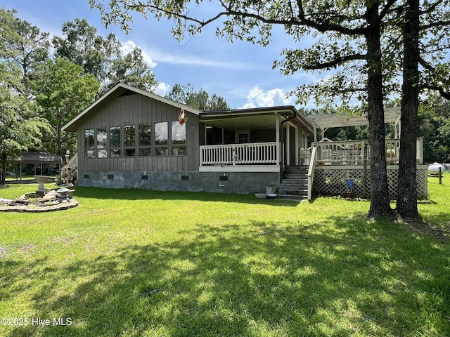 258 Hideaway Rd, Belhaven, NC 27810 - view of front of property featuring crawl space, a front lawn, stairway, and a deck