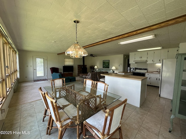 258 Hideaway Rd, Belhaven, NC 27810 - tiled dining area featuring a chandelier and a sink