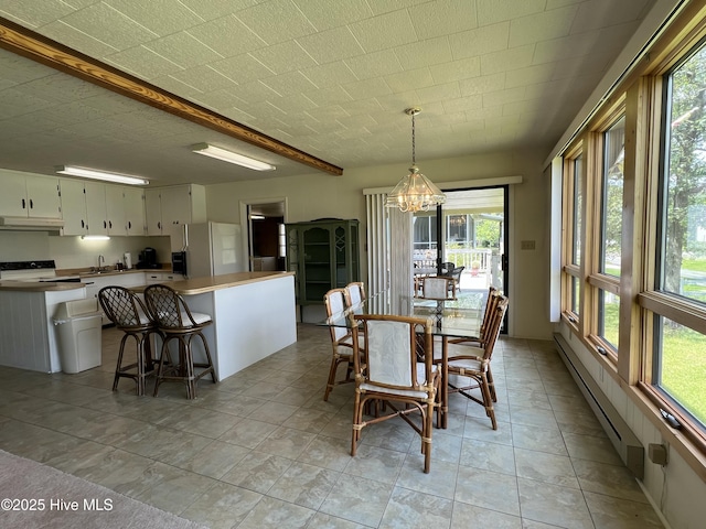 258 Hideaway Rd, Belhaven, NC 27810 - dining area featuring a chandelier and a baseboard radiator
