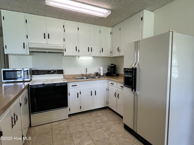 258 Hideaway Rd, Belhaven, NC 27810 - kitchen with white refrigerator with ice dispenser, electric stove, under cabinet range hood, stainless steel microwave, and white cabinetry