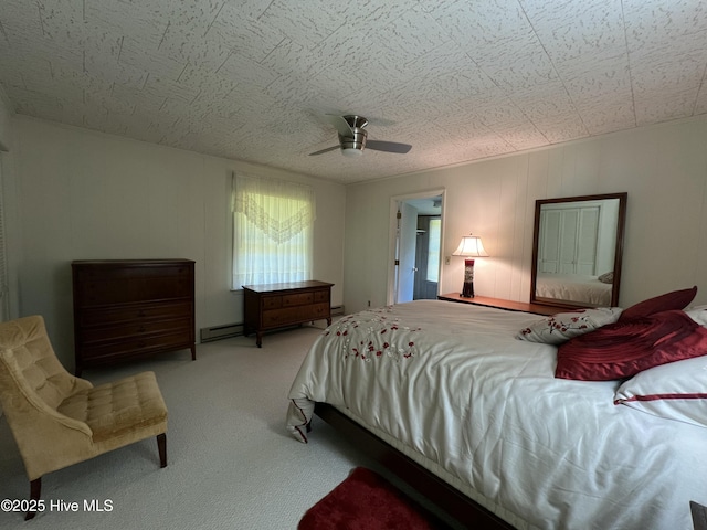 258 Hideaway Rd, Belhaven, NC 27810 - bedroom with carpet, a baseboard heating unit, and a ceiling fan