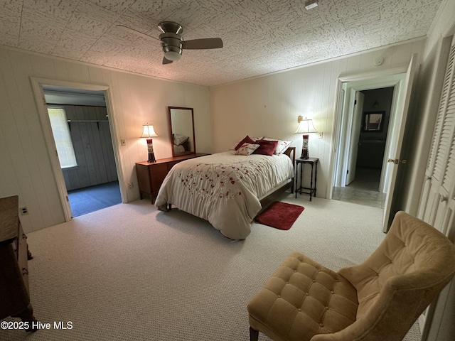 258 Hideaway Rd, Belhaven, NC 27810 - carpeted bedroom with ceiling fan and wood walls