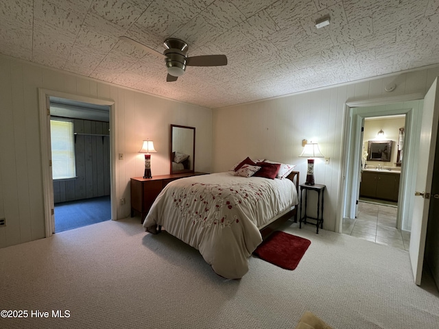 258 Hideaway Rd, Belhaven, NC 27810 - bedroom featuring carpet floors, ensuite bathroom, and a ceiling fan