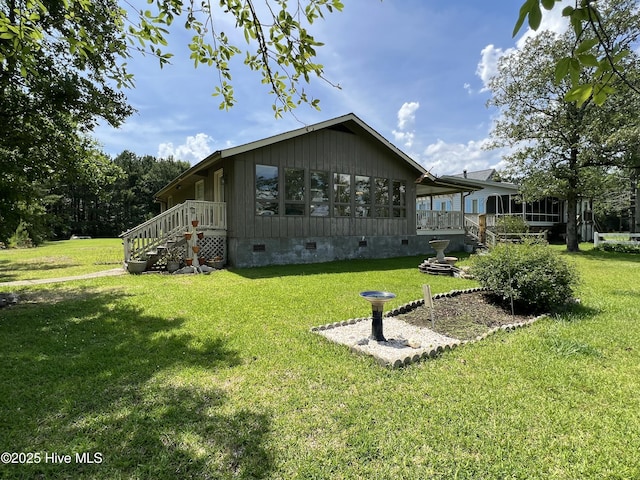 258 Hideaway Rd, Belhaven, NC 27810 - rear view of house with crawl space and a lawn