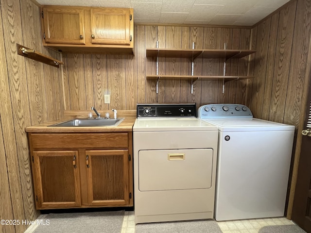 258 Hideaway Rd, Belhaven, NC 27810 - washroom with separate washer and dryer, wooden walls, and cabinet space