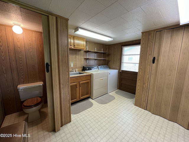 258 Hideaway Rd, Belhaven, NC 27810 - laundry room featuring washer and clothes dryer, light floors, and wood walls