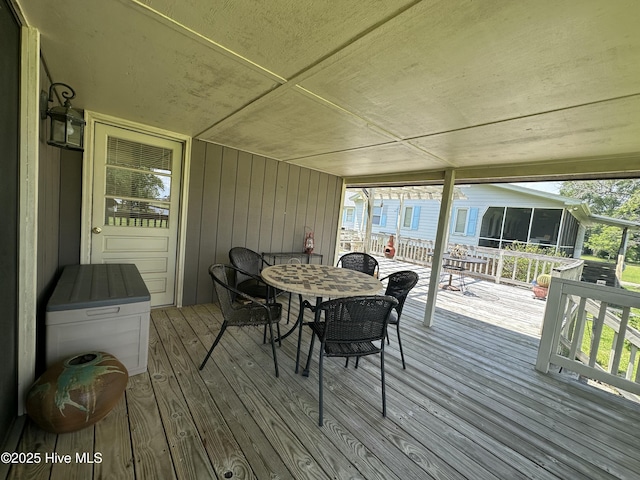 258 Hideaway Rd, Belhaven, NC 27810 - deck featuring a sunroom and outdoor dining area