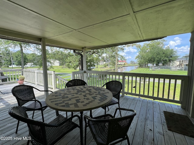 258 Hideaway Rd, Belhaven, NC 27810 - wooden deck with a water view, a lawn, and outdoor dining space