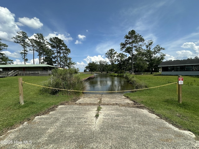 258 Hideaway Rd, Belhaven, NC 27810 - view of community with driveway, a water view, and a yard