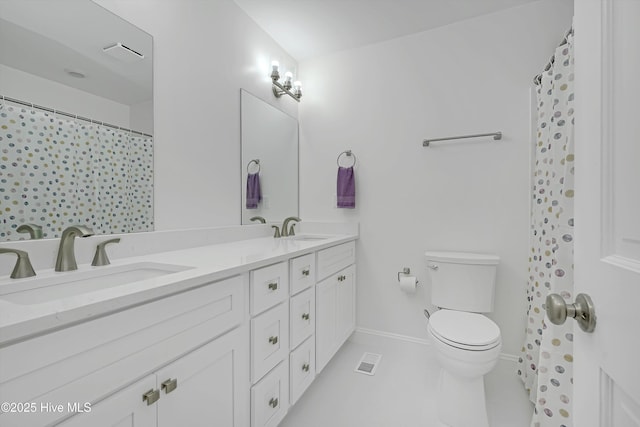 3825 Canterbury Rd, Wilmington, NC 28403 - full bathroom featuring double vanity, toilet, tile patterned flooring, baseboards, and a shower with shower curtain