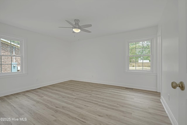 3825 Canterbury Rd, Wilmington, NC 28403 - empty room featuring healthy amount of natural light, light wood-type flooring, and baseboards