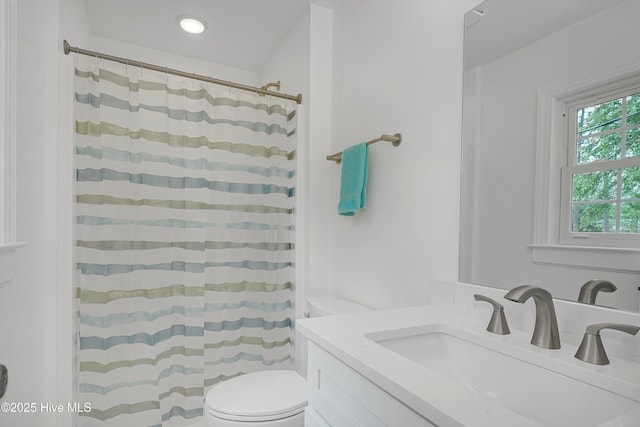 3825 Canterbury Rd, Wilmington, NC 28403 - bathroom featuring toilet, vanity, and a shower with curtain