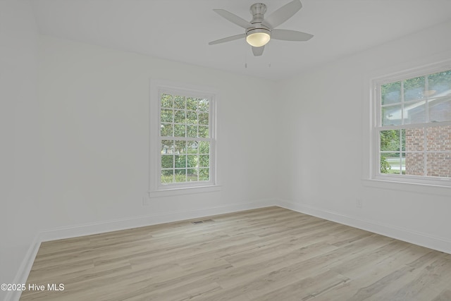 3825 Canterbury Rd, Wilmington, NC 28403 - unfurnished room featuring light wood-style floors, healthy amount of natural light, and baseboards