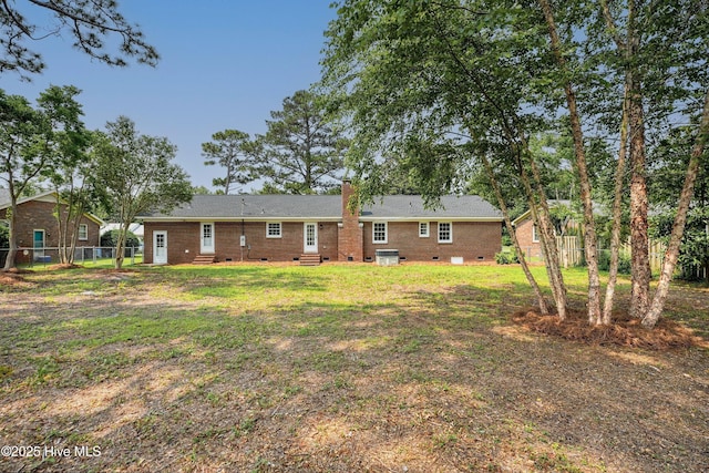 3825 Canterbury Rd, Wilmington, NC 28403 - back of property with entry steps, crawl space, brick siding, a chimney, and central AC