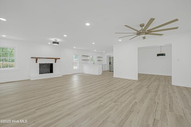 3825 Canterbury Rd, Wilmington, NC 28403 - unfurnished living room featuring recessed lighting, light wood-style flooring, a fireplace, ceiling fan, and baseboards