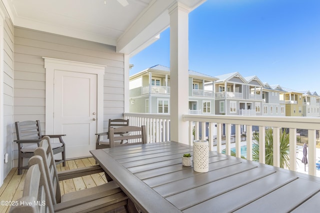 205 Islander Dr Unit B2, Emerald Isle, NC 28594 - balcony with outdoor dining space and a residential view