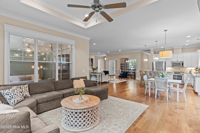 712 Tanbridge Rd, Wilmington, NC 28405 - living room with crown molding, a ceiling fan, light wood-type flooring, and recessed lighting