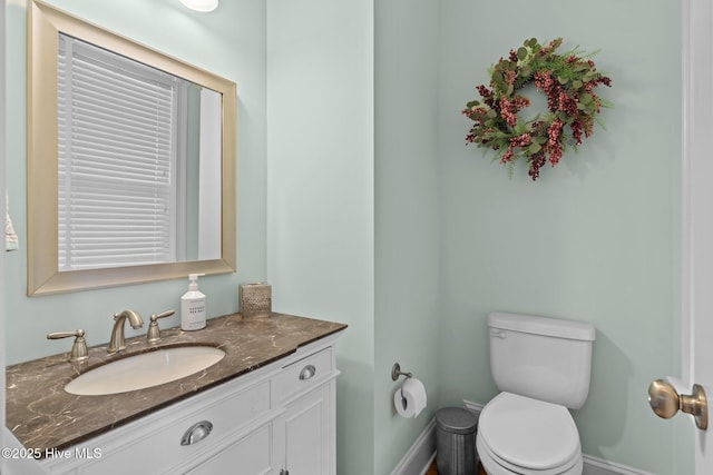 712 Tanbridge Rd, Wilmington, NC 28405 - bathroom featuring vanity, toilet, and baseboards
