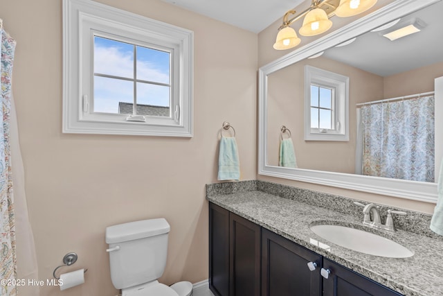 712 Tanbridge Rd, Wilmington, NC 28405 - bathroom featuring vanity, toilet, and a shower with shower curtain