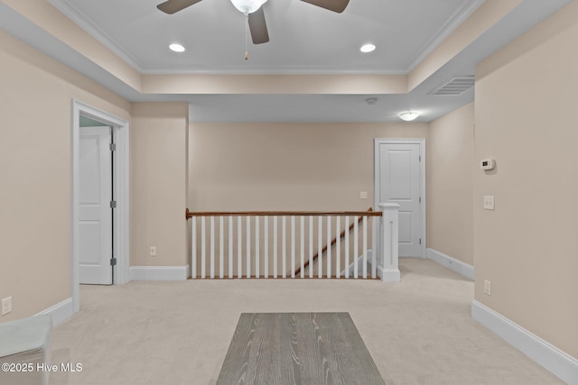 712 Tanbridge Rd, Wilmington, NC 28405 - carpeted spare room featuring a tray ceiling, ceiling fan, ornamental molding, recessed lighting, and baseboards