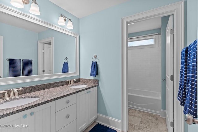 712 Tanbridge Rd, Wilmington, NC 28405 - bathroom featuring double vanity, baseboards, and shower / washtub combination