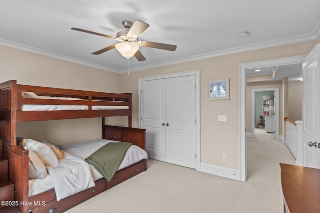712 Tanbridge Rd, Wilmington, NC 28405 - bedroom featuring light colored carpet, a closet, crown molding, baseboards, and a ceiling fan