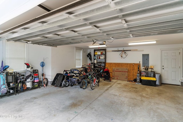 712 Tanbridge Rd, Wilmington, NC 28405 - garage featuring electric panel and a garage door opener
