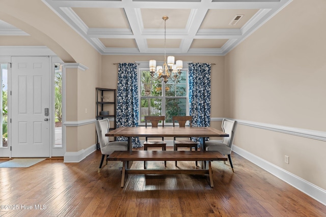712 Tanbridge Rd, Wilmington, NC 28405 - dining space with a chandelier, arched walkways, hardwood / wood-style floors, baseboards, and coffered ceiling