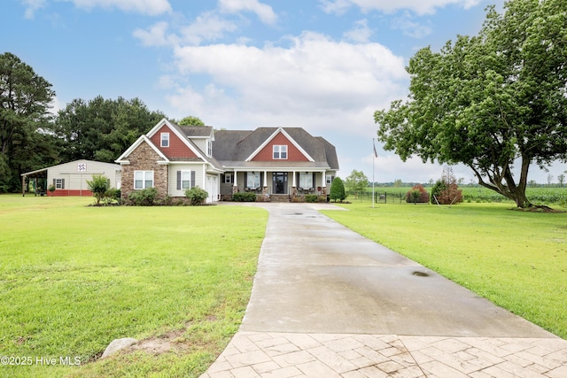 844 E Darden Rd, Faison, NC 28341 - craftsman inspired home with covered porch, concrete driveway, a front lawn, and stone siding