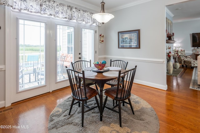 844 E Darden Rd, Faison, NC 28341 - dining space with ornamental molding, wood finished floors, and baseboards