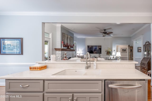 844 E Darden Rd, Faison, NC 28341 - kitchen with stainless steel dishwasher, a sink, open floor plan, a ceiling fan, and light countertops