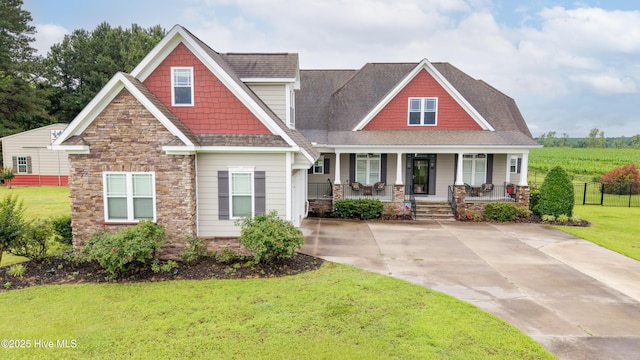 844 E Darden Rd, Faison, NC 28341 - craftsman inspired home featuring stone siding, covered porch, and roof with shingles