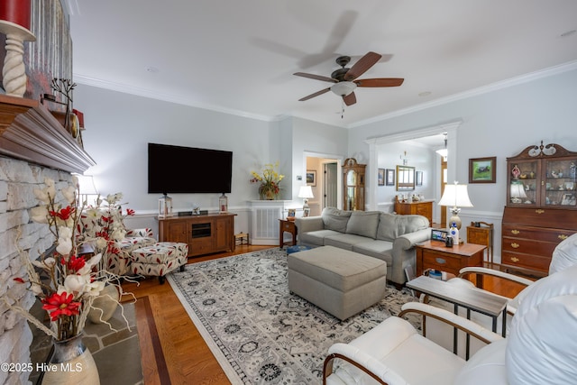 844 E Darden Rd, Faison, NC 28341 - living room with a ceiling fan, crown molding, and a wainscoted wall